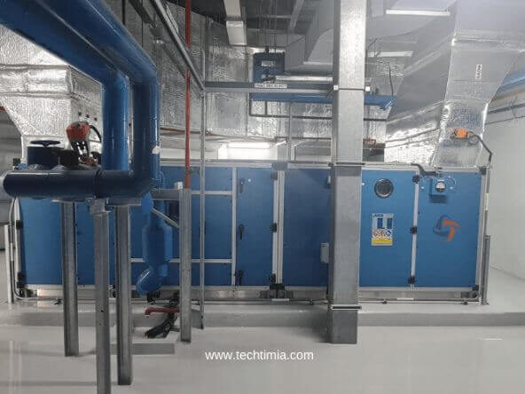 ACMV air handling unit with ductwork inside commercial facility in Singapore
