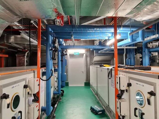 Air Handling Units (AHU) and Blue ACMV Ductwork in Plant Room