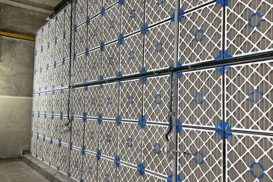 Industrial air filter wall with pre-filters and HEPA filters in a Singapore HVAC facility.